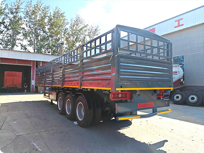 Full side view TRUCKMAN tri-axle stake semi trailer