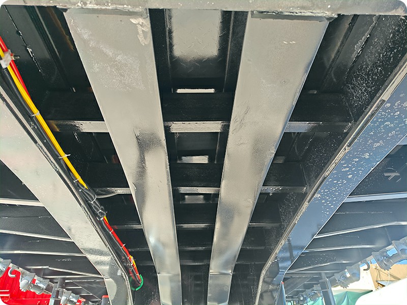 Reinforced I-beam chassis of TRUCKMAN stake semi trailer for rough mine road