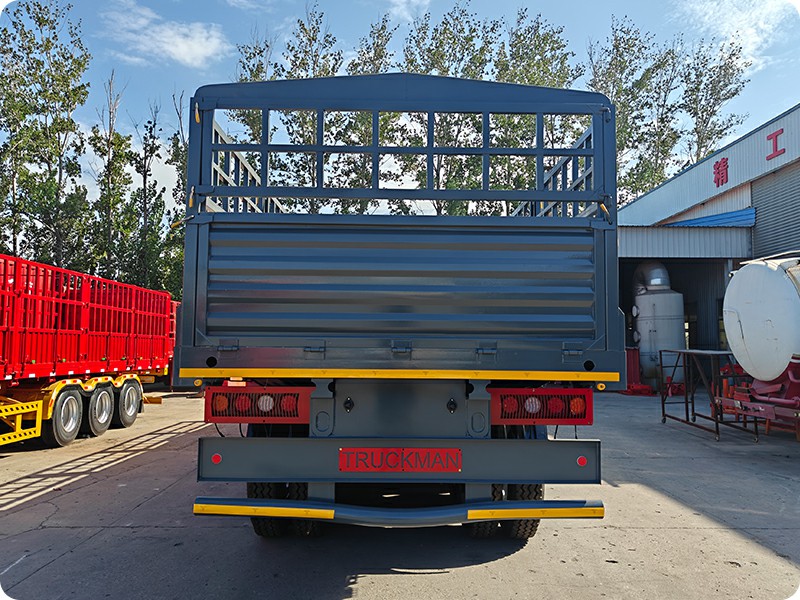 Rear view of TRUCKMAN tri-axle stake semi trailer with rear lights