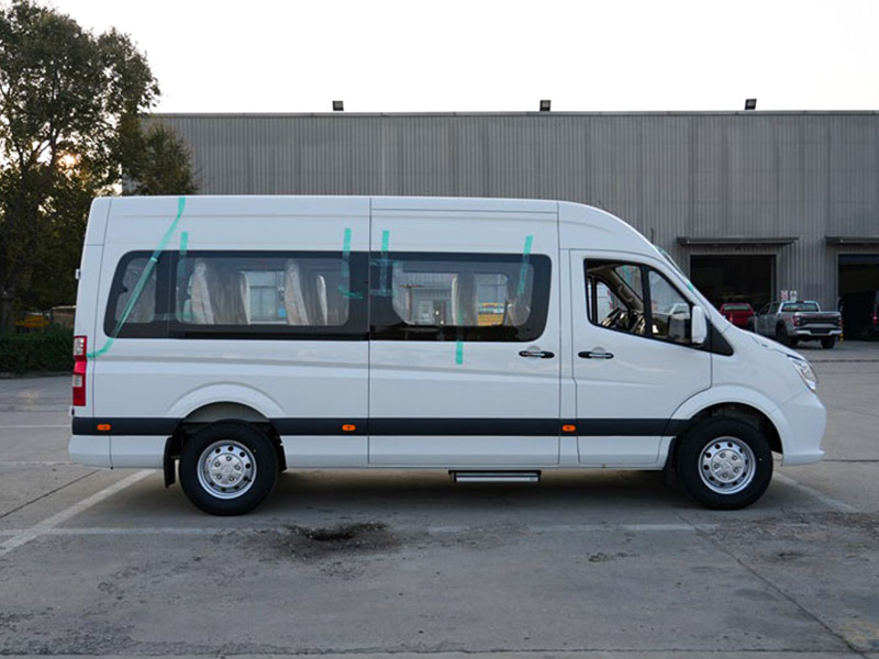 White FOTON TOANO 4x2 tour bus side profile showing full length and sliding door