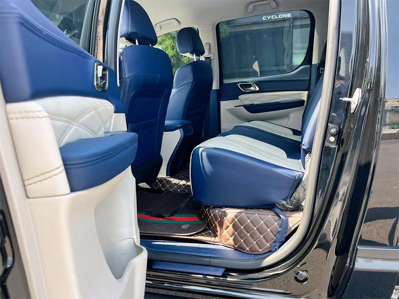 Interior of FOTON TUNLAND G9 pickup with leather seats and multifunction steering wheel