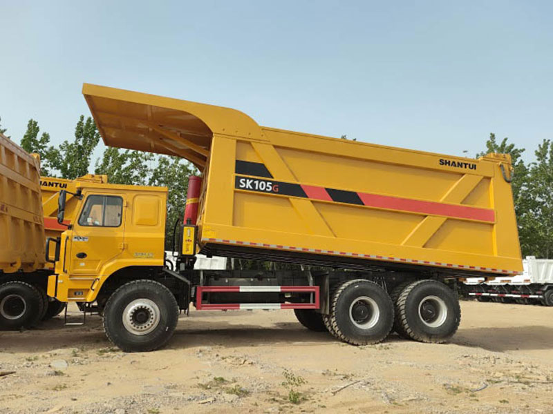 SHANTUI SK105 110 tons 10 wheels mining tipper truck exterior view for heavy load mining transport.