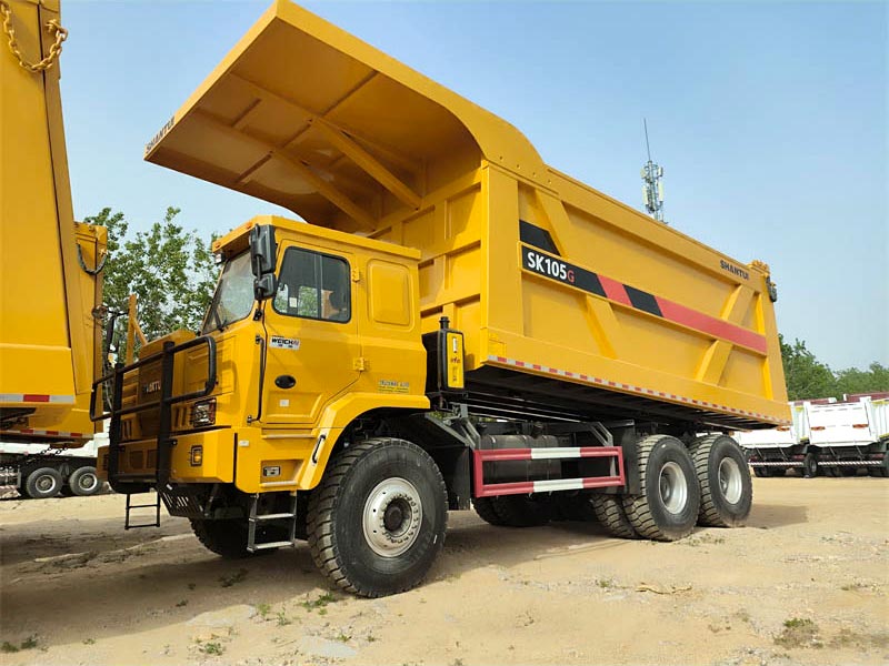Side profile of SHANTUI SK105 110 tons mining dump truck showing 10 wheels and strong chassis.