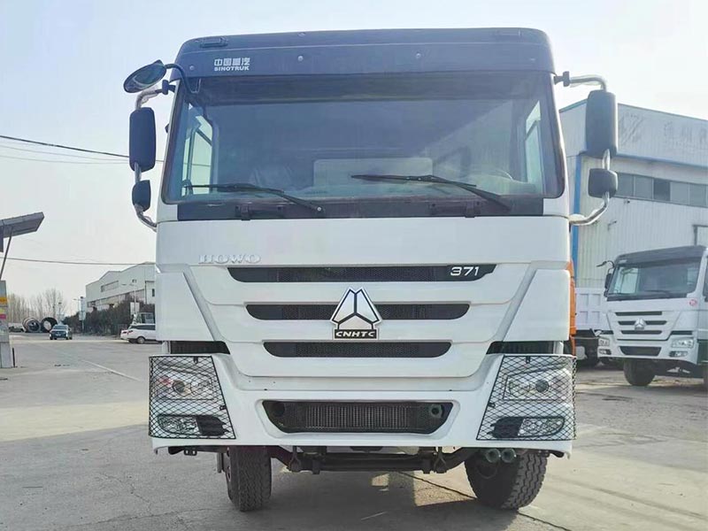 Front view of SINOTRUK HOWO 371HP dump truck with reinforced bumper and large chassis.